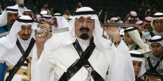King Abdullah of Saudi Arabia, center, holds his sword as he takes part in the traditional Arda dance, or War dance, during the Janadriyah Festival of Heritage and Culture on the outskirts of Riyadh, Saudi Arabia, Tuesday, March 10, 2009. (AP Photo/Hassan Ammar)
