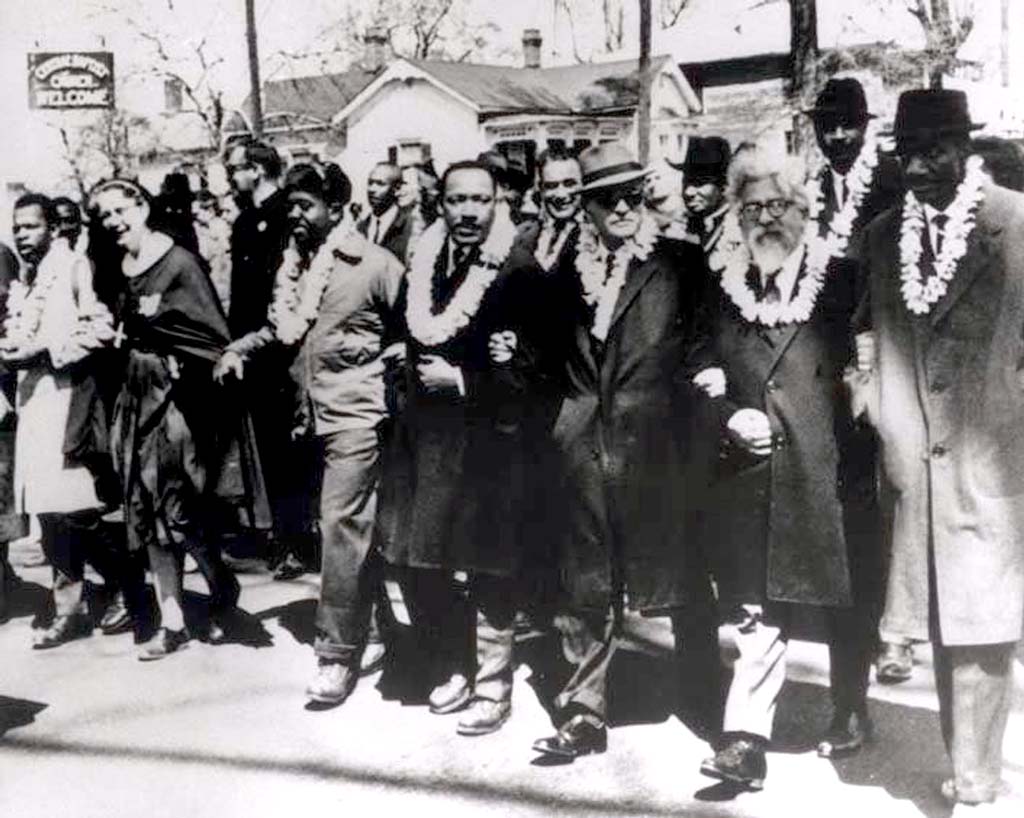 Martin Luther King, Jr. (center) and Abraham Joshua Heschel (2nd from front right), march from Selma to Montgomery, Alabama, March 21, 1965.
